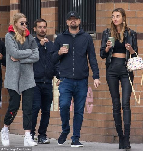 Leonardo DiCaprio meets at once with two models
