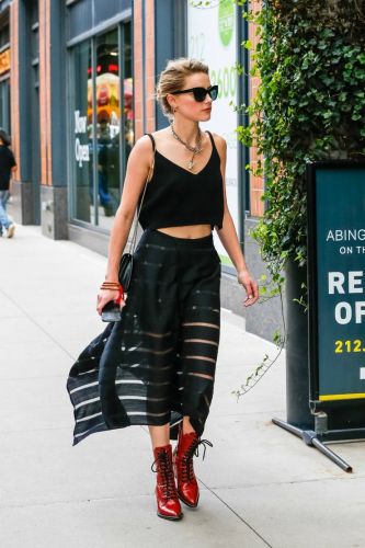 Amber Heard in a transparent skirt and a crocheted top without linen