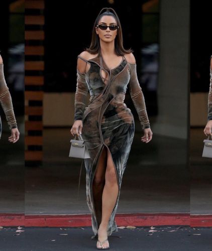 Kim Kardashian emphasized the curvaceous form with a tight velour dress