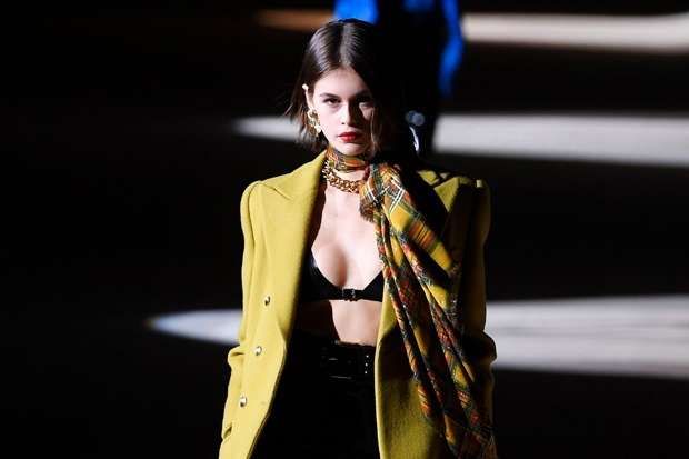 Kaia Gerber wearing a latex bra became the Saint Laurent star show