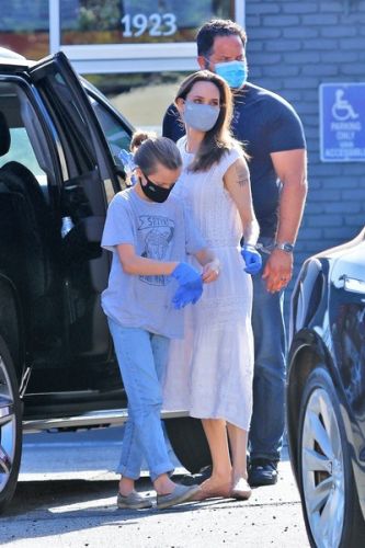 Angelina Jolie in a protective mask went shopping with her daughter